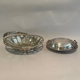 A Stainless Bread Basket With A Covered Vegetable Bowl