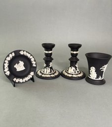 Group Of Wedgwood Black Basalt Jasperware: Pair Of Candlesticks, Ashtray And Small Vase
