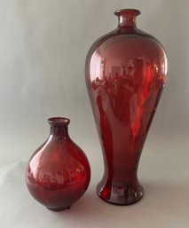 Two Tall Red Glass Vases