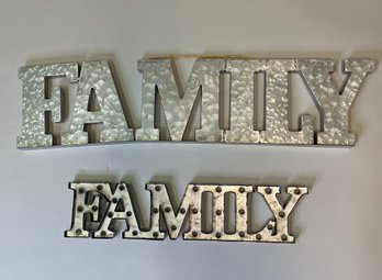 Two Aluminum 'Family' Signs