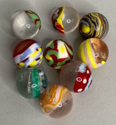 Collection Of Nine Handmade Floral Inset Glass Marbles