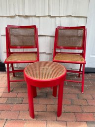 Three Piece Red Wood/Cane Table/Folding Chair Set