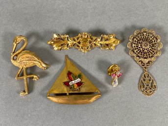 Gold Tone Brooches And Pins