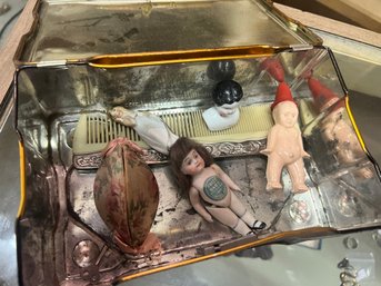 Lot 120 - Small Tin Box Of Dolls Incl A Lovely Small Bisque Doll With Label