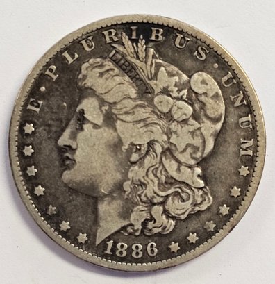1886 O MORGAN DOLLAR COIN  .900 SILVER