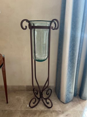 (A) IRON PLANT STAND WITH BLOWN GLASS INSERT - 42' TALL BY 20' WIDE