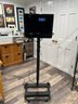 (A) WORKING 'INVU' STANDING TV / DVD PLAYER FOR EXERCISE ROOM