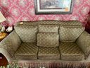 VINTAGE GREEN UPHOLSTERED SOFA WITH FRINGE TRIM & PILLOWS - GOOD CONDITION - 90' LONG BY 42' DEEP BY 28' HIGH