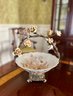 (DR) PORCELAIN CENTERPIECE BOWL WITH IRON BRANCH HANDLE DECORATED WITH FLOWERS & BIRDS - BRASS BASE-14' BY 10'