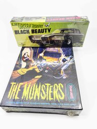 (D-28) VINTAGE LOT OF 2 SEALED PLASTIC KITS-THE MUNSTERS AND GREEN HORNET BLACK BEAUTY-POLAR LIGHTS