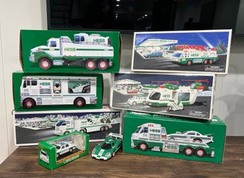 (A-96) EIGHT VINTAGE HESS TRUCKS IN BOX - NEW