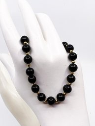 (J-4) VINTAGE 8' 14 KARAT GOLD AND BLACK AGATE BRACELET