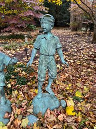 ADORABLE BRONZE BOY GARDEN SCULPTURE WITH ROCKS AT HIS FEET - 46' HIGH BY 24'WIDE BY 19' DEEP