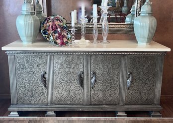 SILVER TONED FOUR DOOR WOOD BUFFET SIDEBOARD W/CARVED DETAIL -COMPOSITE TOP- SOME DINGS TO SURFACE, SEE PICS