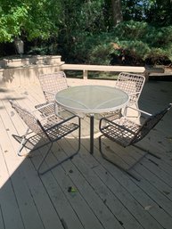 VINTAGE GLASS TOP 42' ROUND PATIO SET WITH FOUR WEBBED CHAIRS - NEEDS TLC