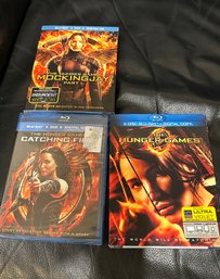 (M-25) THREE DVD'S 'HUNGER GAMES, MOCKING JAY & CATCHING FIRE' - SEALED