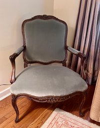 VINTAGE VELVET UPHOLSTERED ARMCHAIR WITH NAILHEAD DETAIL & HAND CARVED WOOD BASE & LEGS - 38' H BY 25' W BY 28