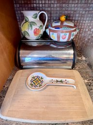 (C-6) KITCHEN ESSENTIALS INCLUDING 14' WOOD CUTTING BOARD, ITALY COVERED BOWL, PITCHER, BREAD BOX, SPOON REST