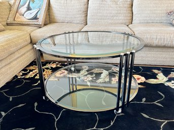 POST MODERN ROUND GLASS & CHROME COFFEE TABLE WITH BOTTOM SHELF & WHEELS - 35' ROUND BY 18' HIGH