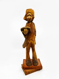 (U-106) SIGNED W. A. HANDLEWICH WOOD CARVING - MAN STANDING ON BOOKS - 12.5' TALL