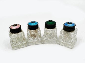 (A-56) SET OF FOUR ANTIQUE CUT GLASS SALT AND PEPPER SHAKERS WITH ENAMEL GUILLOCHE TOPS