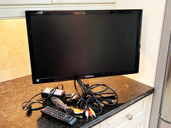 (K-6) SAMSUNG 24' MONITOR WITH ALL REMOTE AND CABLES PICTURED