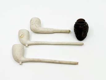 (J-27) FOUR ANTIQUE PIPES-3 CLAY PIPES AND 1 DARK WOOD CARVED FACE