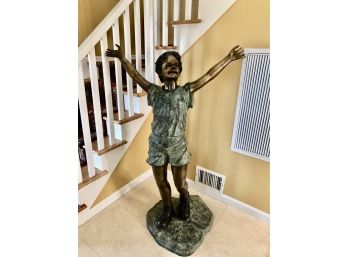 C-20- LARGE BRONZE YARD STATUE- BOY WITH RAISED HANDS- MEASURES- 54' TALL X 40' WIDE