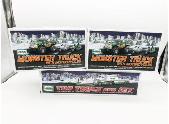 (78) LOT OF 3 NEW IN BOX HESS TRUCKS-2 MONSTER TRUCKS W/MOTORCYCLE-1 TOY TRUCK AND JET