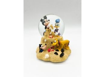 D-38- DISNEY MUSICAL SNOW GLOBE -MICKEY BEACH DAY WITH GOOFY, PLUTO & DONALD- PLAYS 'BY THE BEAUTIFUL SEA'- 6'