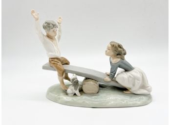 A-13- LLADRO FIGURINE - BOY & GIRL ON SEE SAW WITH DOG - 9' LONG BY 7' HIGH - PERFECT