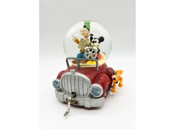 D-30 -DISNEY MUSICAL SNOW GLOBE -MICKEY, PLUTO & GOOFY DRIVING A CRANK CAR - PLAYS 'ZIP-A-DEE-DOO-DA '- 7'