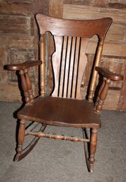 Antique Oak Solid Seat Spindled  Arm Rocker  (223)