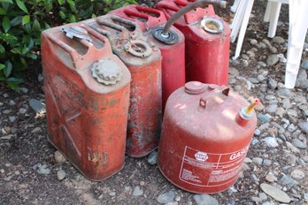 4 Gerry Fuel Cans, And One 5 Gallon Can   (293)