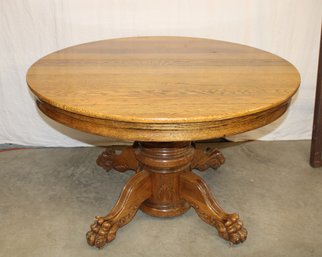 48' Round Oak Table W/carved Claw Feet, Shaped Apron, Split Pedestal W/center Leg  (297)