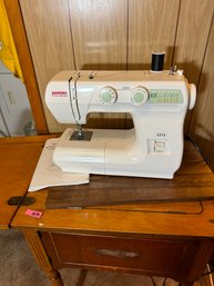 Janome Model 2212 Sewing Machine W Manual, Foot Pedal, And Vintage Table