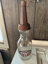 Glass Bottle With Lid Labeled Farmall McCormick