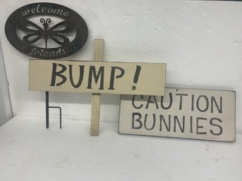 Three Decorative Outdoor Signs