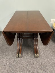 Antique Mahogany Drop-Leaf Table With Paw Feet And Multiple Extension Leaves