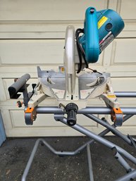Lot 198 Makita Miter Saw And Rigid Stand / Utility Vehicle