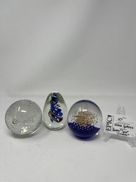 Lot 47  Two GLASS EYE STUDIO Glass Spheres Paper Weight Set Of 3