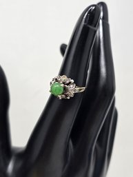 Lot 473 18 Karat Jade Centerpiece Ring, Surrounded With Diamond Cut Stones. 3 Grams