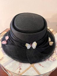 Lot 62  Elegant Black Net Woman's Hat Adorned With Delicate Butterflies  Perfect For Chic Events