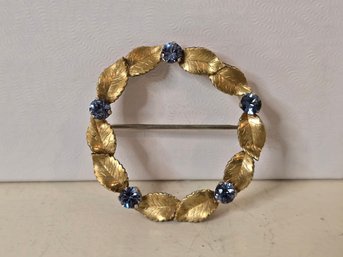 Lot 261 Vintage KREMENTZ Gold Toned Leaf - Blue Crytal Thinestones Circle Brooch Pin