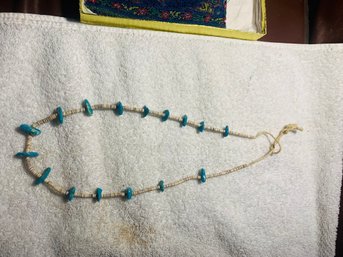 Turquoise Looking Stone & Puka Shell Necklass Interesting