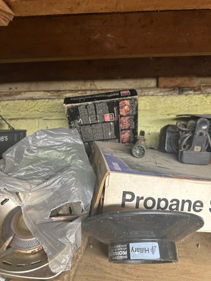 Contents Of A Workshop Shelf And Fishing Equipment