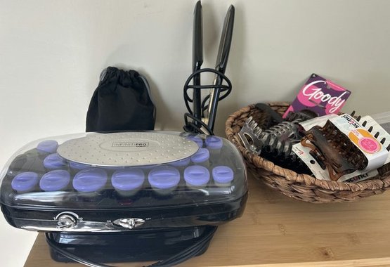 Kipozi Straightener, Curlers, And A Basket Of Hair Clips, And Bob