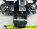 Nikon EM Camera W/ Tiffin 52mm Lens, Nikon SB-E Speedlight, Additional Lens