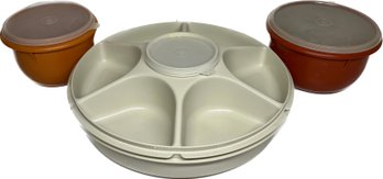 Tupperware Veggie Party Tray With Dip Bowl, Orange Tupperware Bowl, And Red Tupperware Bowl.