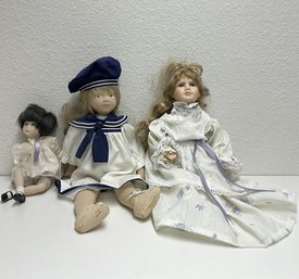 (Three) Porcelain Dolls